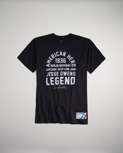 A black t-shirt commemorating athlete Jesse Owens with text highlighting his achievements at the 1936 Berlin Olympics