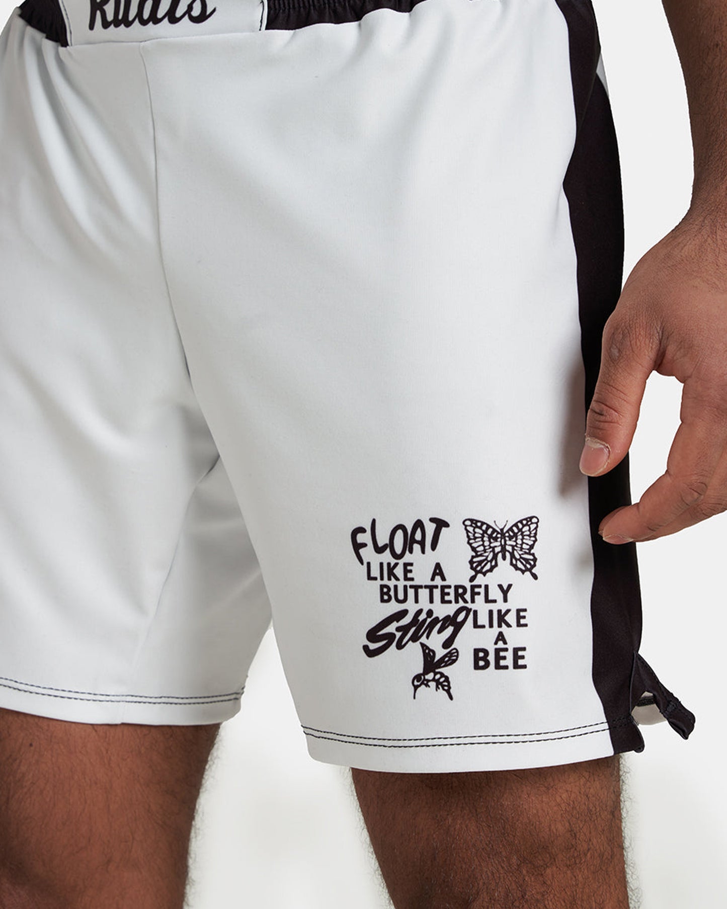 These athletic shorts feature a slogan on the side that reads FLOAT LIKE A BUTTERFLY STING LIKE A BEE accompanied by illustrations of a butterfly and a bee