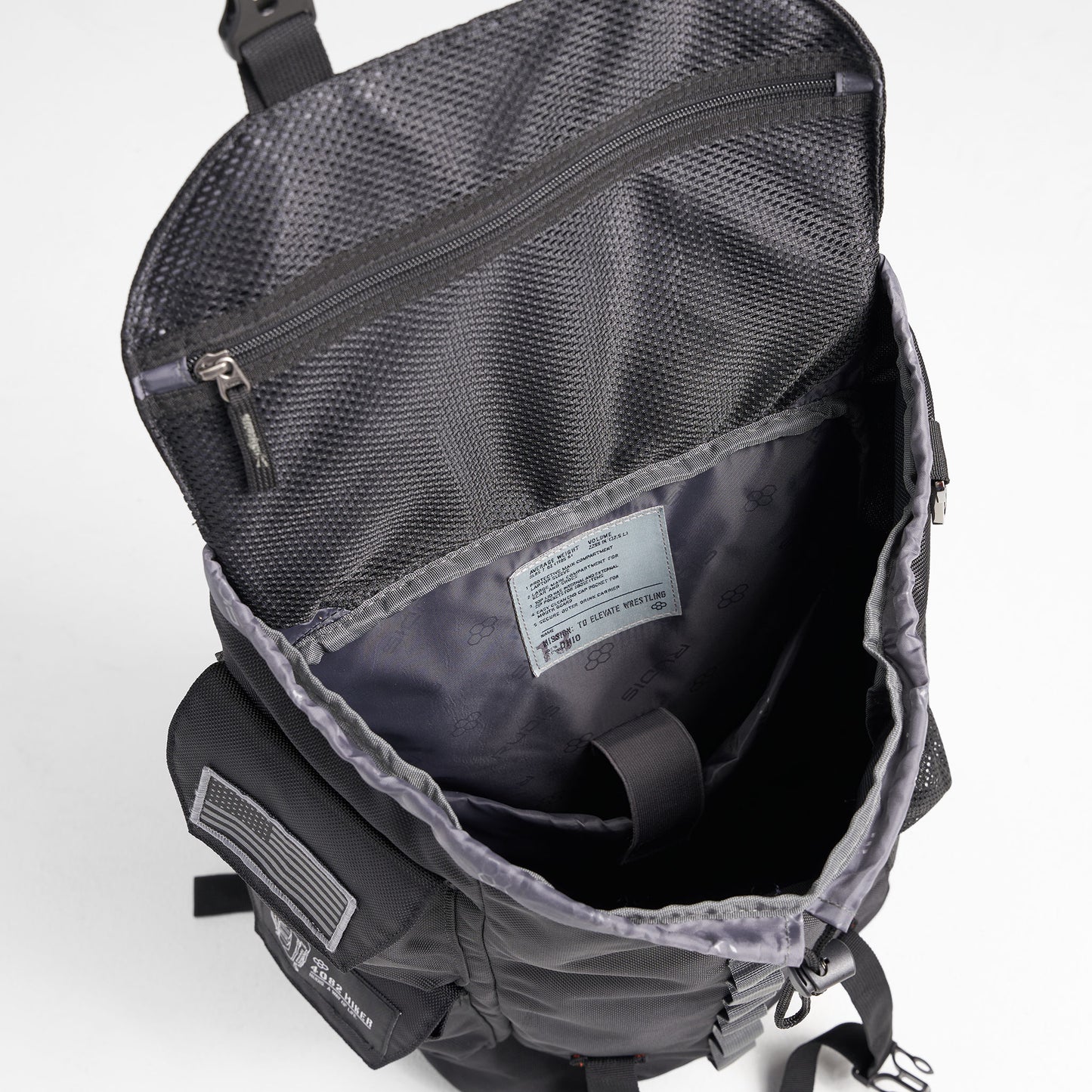 An overhead view of a black backpack with a spacious interior and multiple pockets