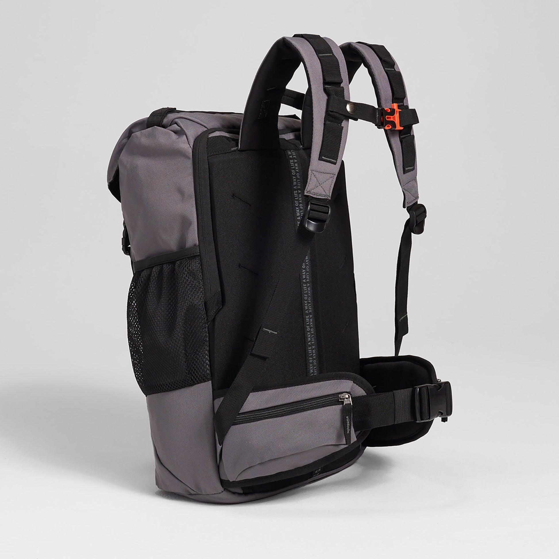 A stylish gray backpack featuring padded shoulder straps a breathable mesh side pocket and a zippered compartment