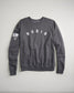 A dark gray sweatshirt with RUDIS emblazoned across the chest and an American flag design on the sleeve