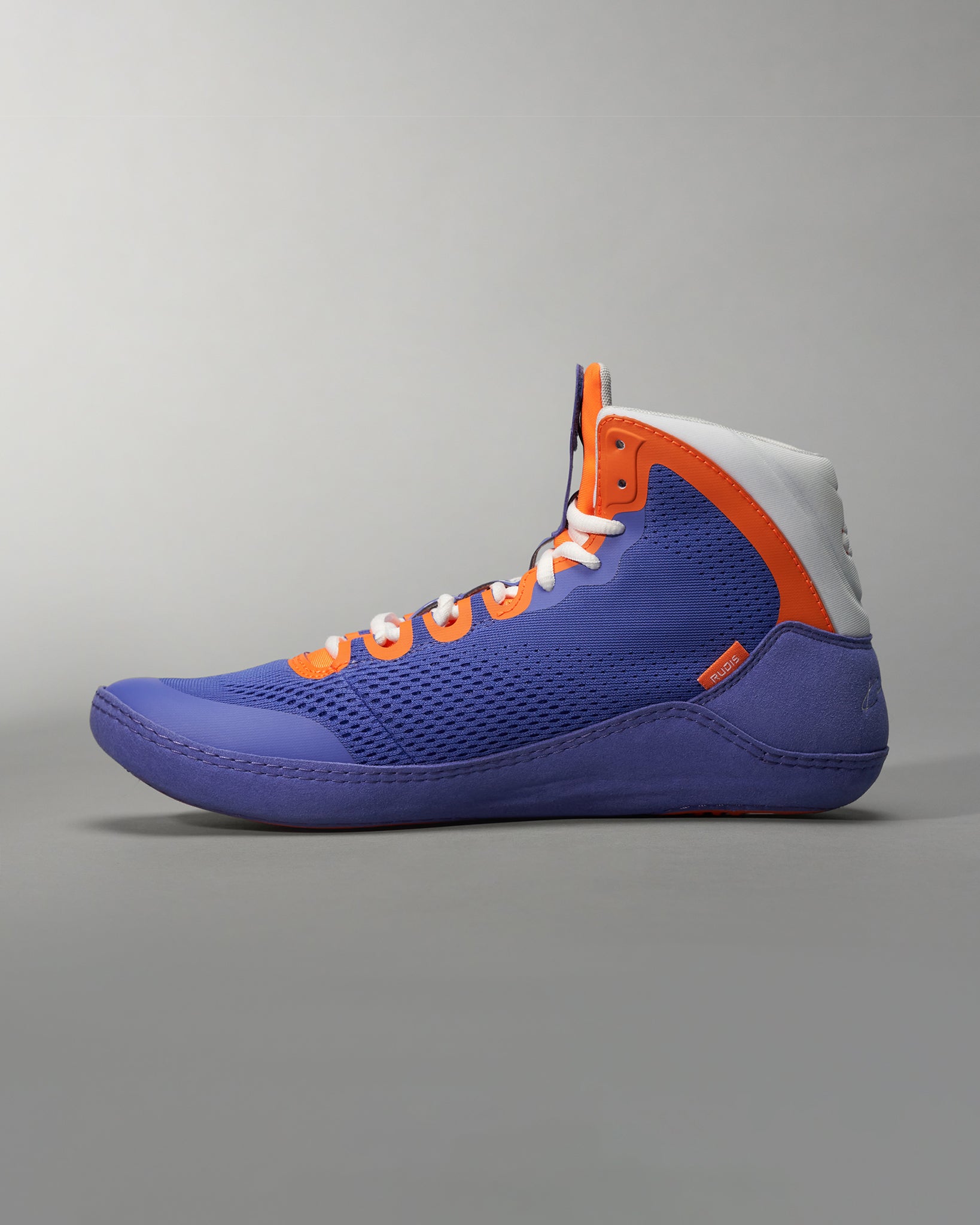 A vibrant high-top athletic shoe in purple orange and white designed for performance and style