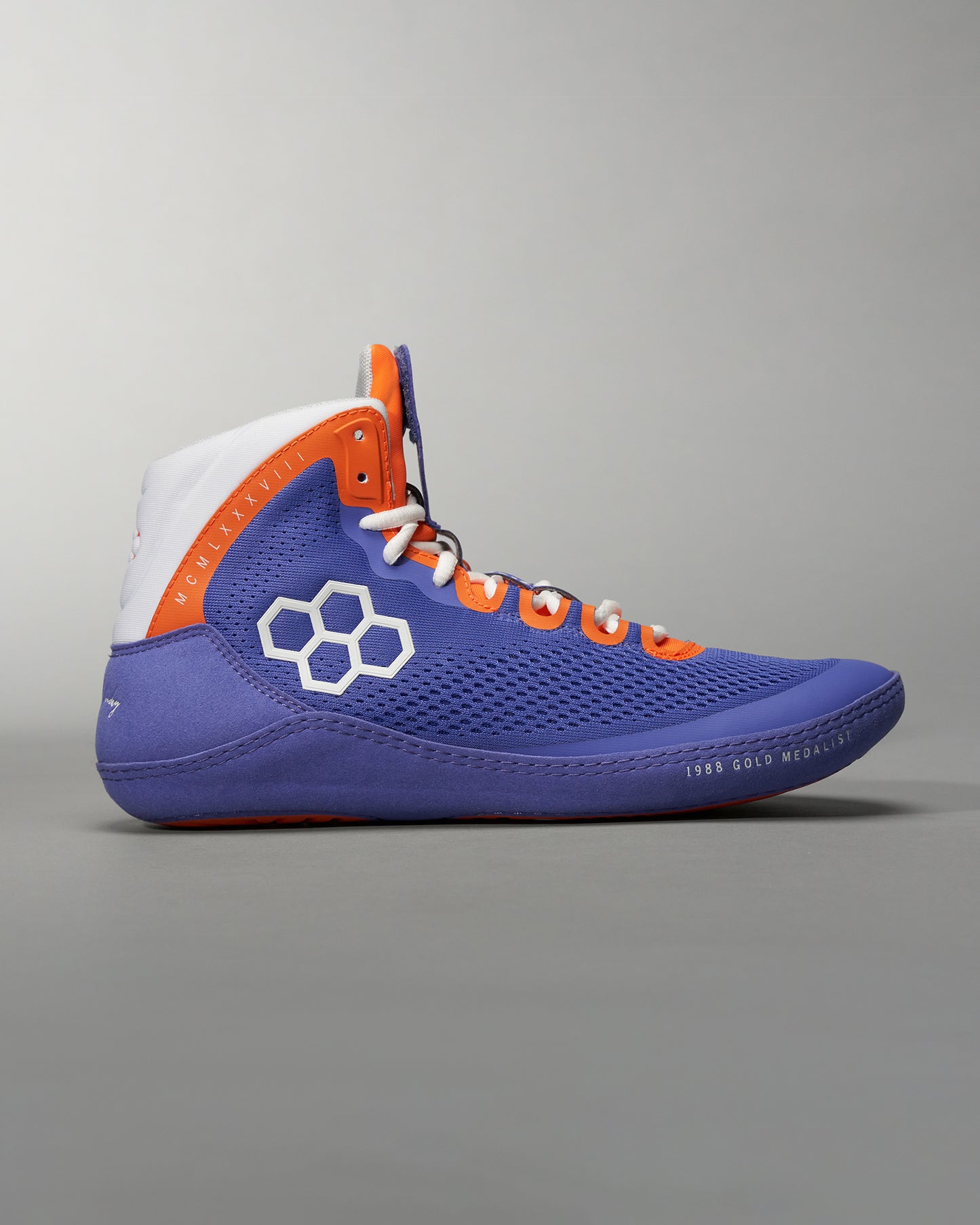 A vibrant blue and orange high-top athletic shoe featuring a breathable mesh upper and unique geometric logo design