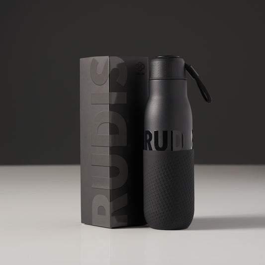 A sleek black water bottle with textured grips and a branded box symbolizing modern design and functionality