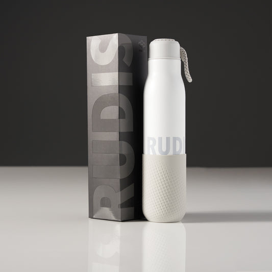 A sleek white water bottle with a textured gray base and packaging designed for stylish hydration on the go