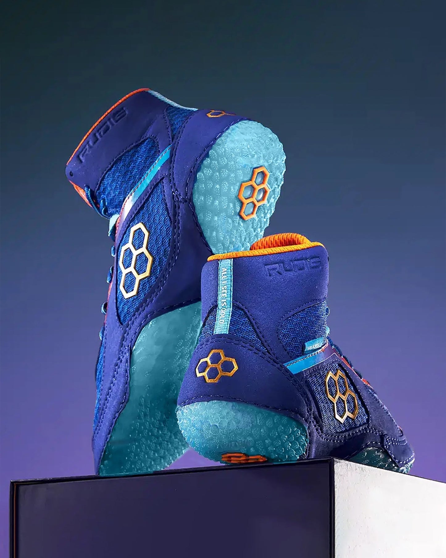 A pair of vibrant blue athletic shoes featuring a high-top design striking orange and turquoise accents and a textured sole suitable for optimal grip