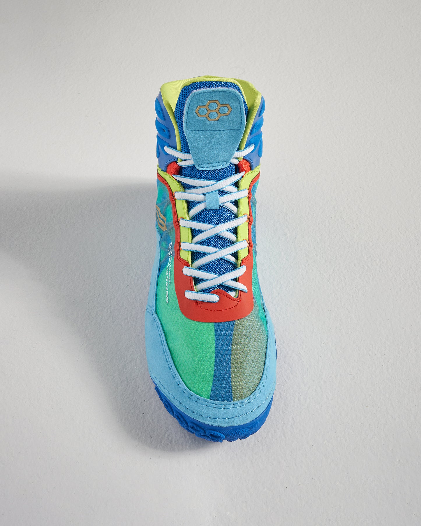 A vibrant multi-colored athletic shoe featuring a breathable mesh upper and a unique design