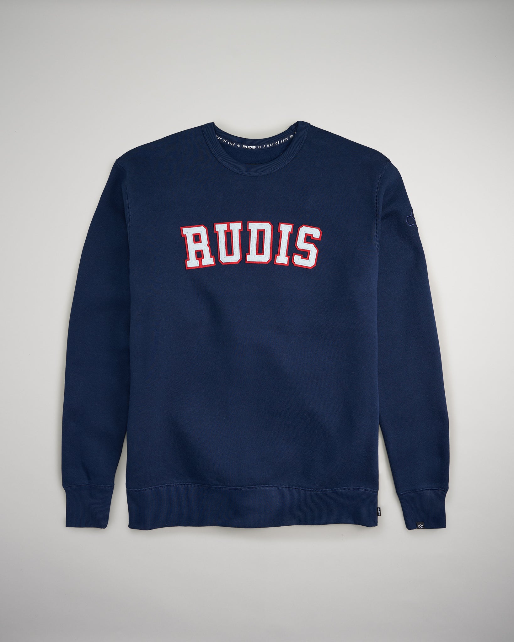 A navy blue sweatshirt featuring the word RUDIS prominently displayed in bold white and red letters across the chest designed for comfort and casual style