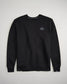 A black crewneck sweatshirt featuring a small stylized hexagon logo on the left chest area showcasing a clean and minimalist design