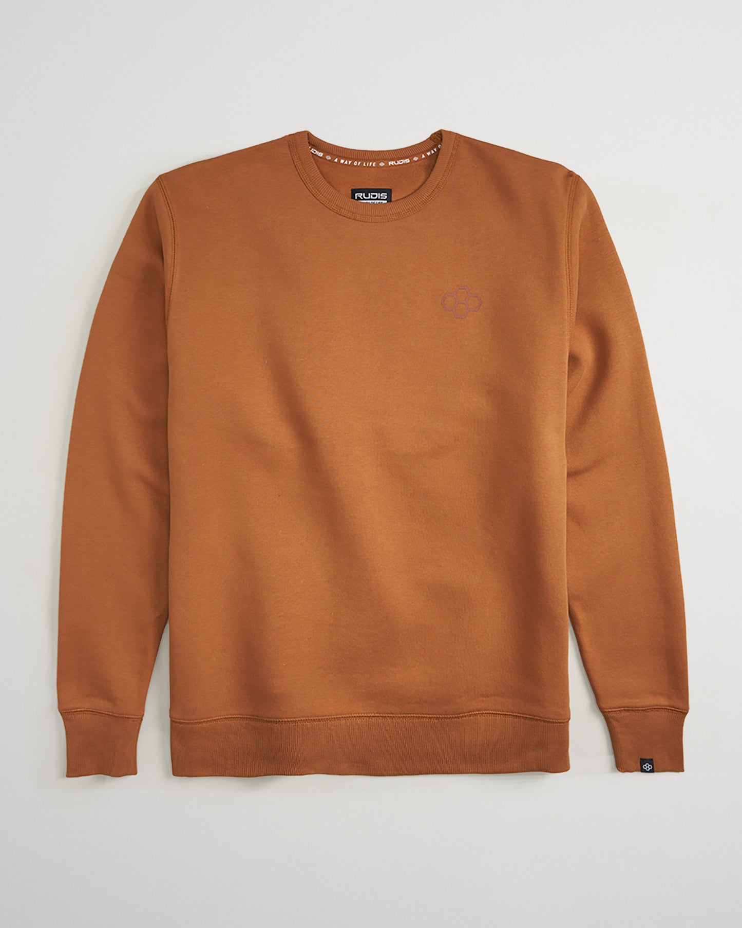 A stylish brown sweatshirt featuring a simple design ribbed cuffs and a subtle logo on the chest area