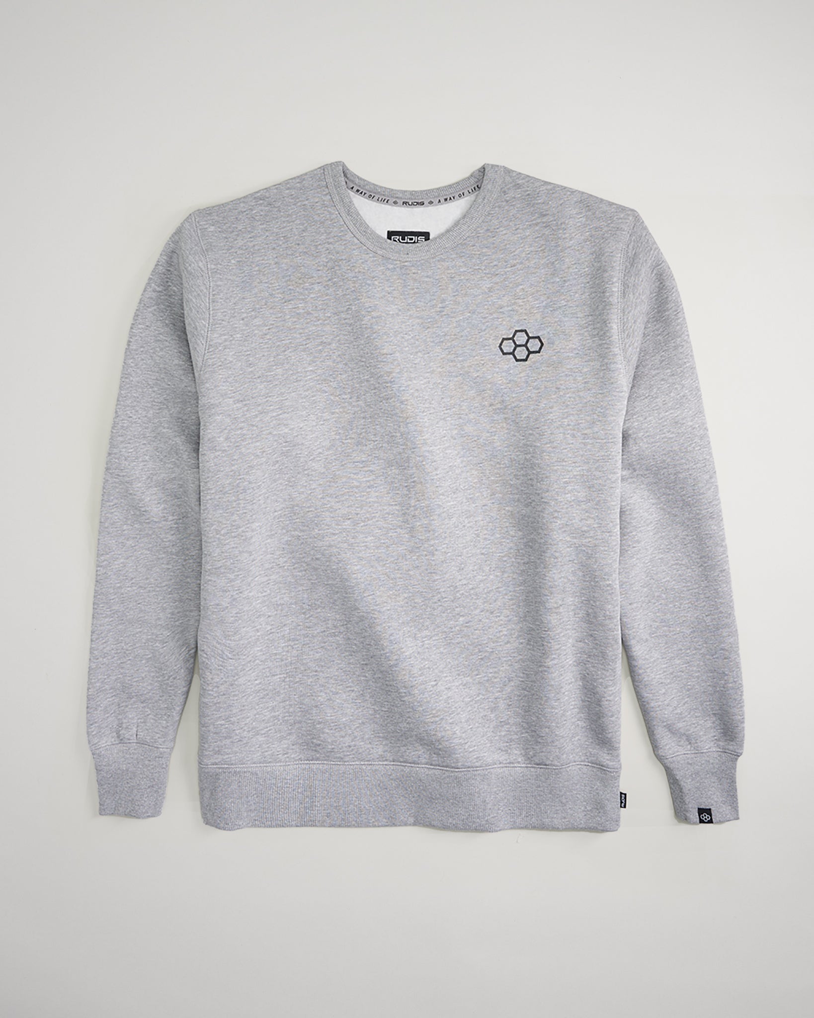 A light gray crewneck sweatshirt featuring a subtle embroidered design on the chest and a comfortable fit ideal for casual wear