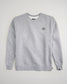 A light gray sweatshirt featuring a black embroidered logo on the chest and ribbed cuffs and hem for a snug fit