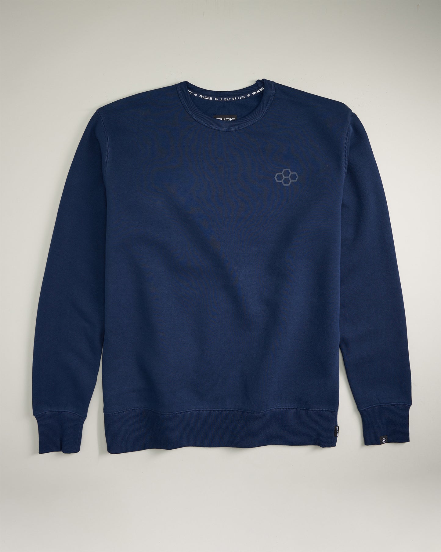 A navy blue sweatshirt featuring a simple design long sleeves and a subtle logo on the chest ideal for casual wear