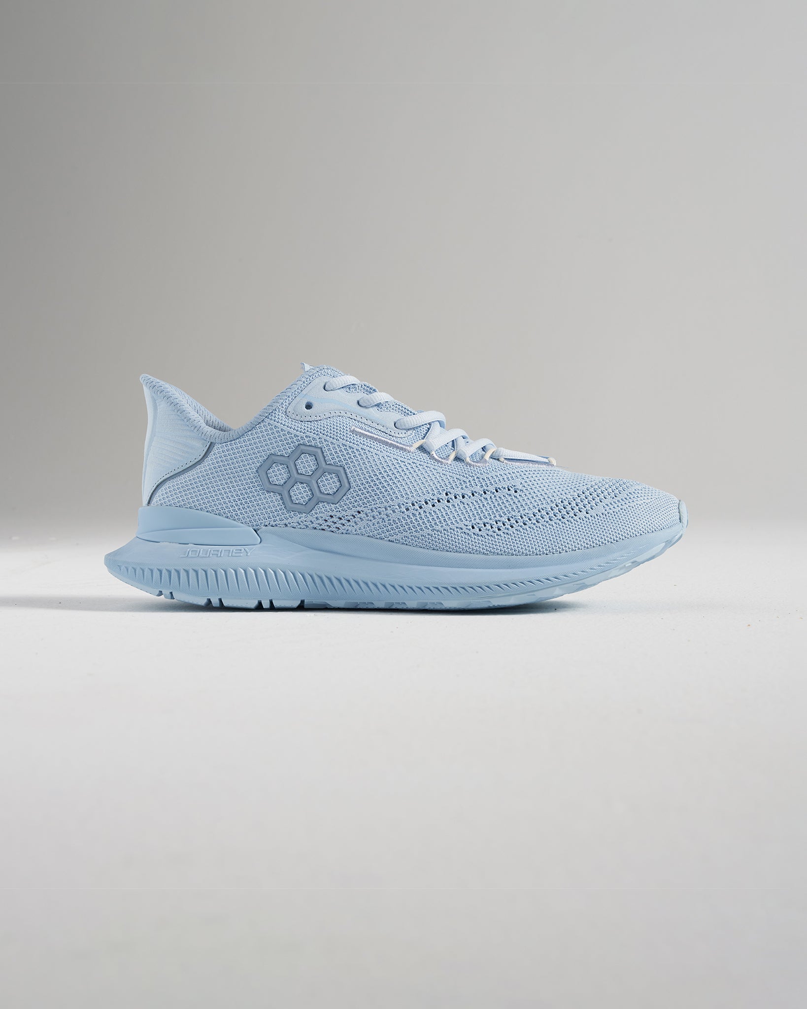 Light blue athletic shoe with a breathable mesh upper and a sleek design ideal for running and casual wear