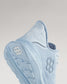 A close-up view of a light blue athletic shoe highlighting its modern design elements and advanced sole features