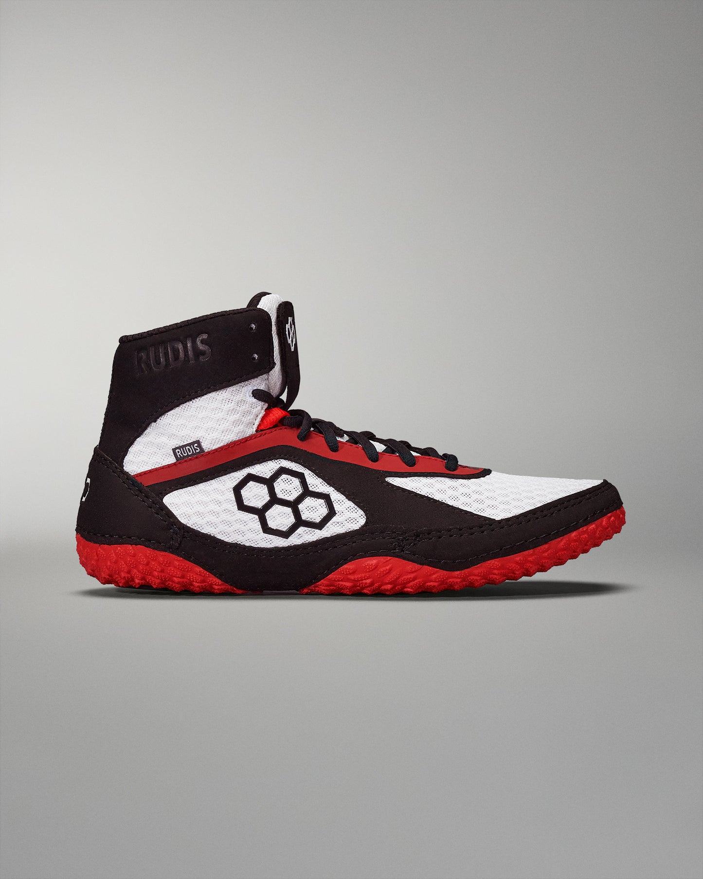 High-top wrestling shoe in black, white, and red featuring a ventilated design, textured outsole for traction, and padded ankle support, marked with the brand 'RUDIS'.