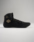 A stylish black athletic shoe featuring gold accents designed for performance with a supportive high-top structure