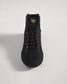 A stylish black high-top sneaker featuring a sleek design with mesh and suede materials gold accents and a durable sole suitable for urban environments