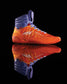 A vibrant pair of orange and purple high-top athletic shoes designed for optimal performance featuring a sleek design with intricate detailing and reflective elements