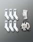 Eight pairs of white athletic socks with black logos and a white knee pad with a matching logo are arranged on a gray background, highlighting performance and support gear.