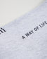 A close-up view of a light gray fabric displaying the text A WAY OF LIFE in bold black letters emphasizing comfort and style