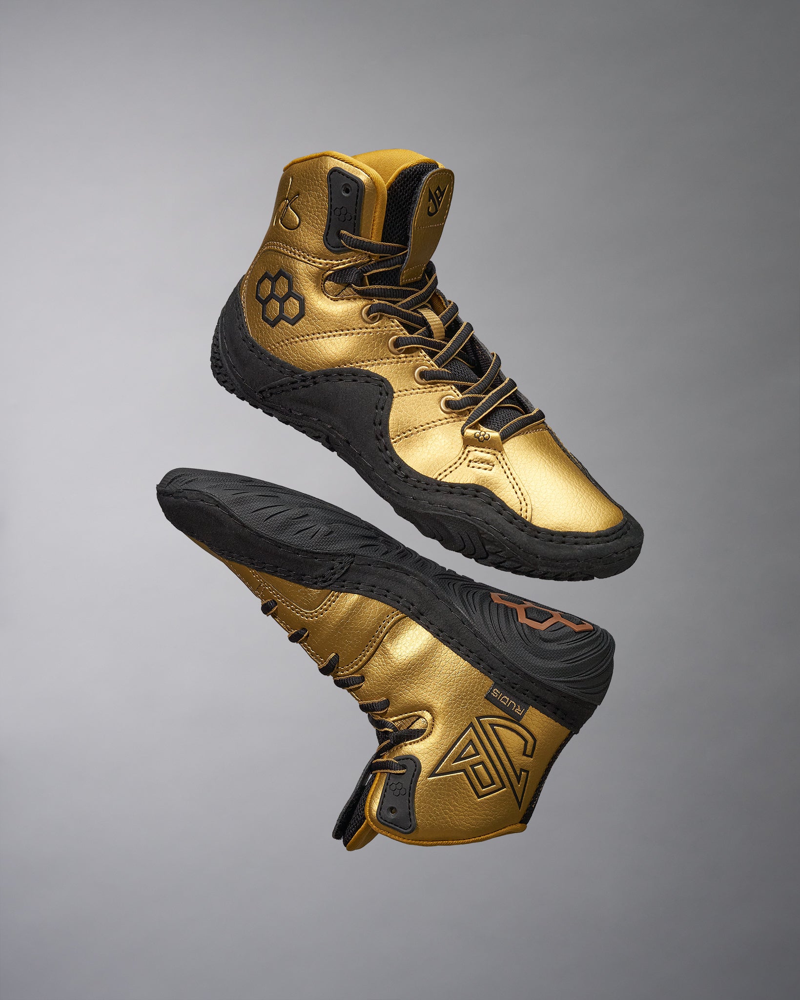 This image showcases a pair of striking gold athletic shoes designed for performance