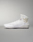 High-top athletic shoe presented in white with a textured sole, gold logo, and padded collar, designed for comfort and performance against a soft gray background.