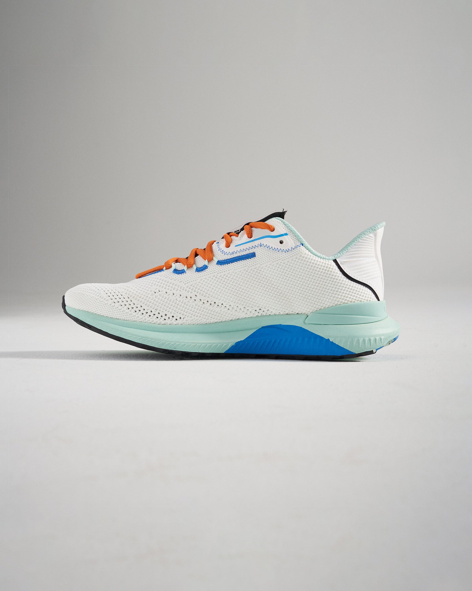 A modern white athletic shoe with colorful accents featuring a breathable mesh upper and a durable sole designed for performance