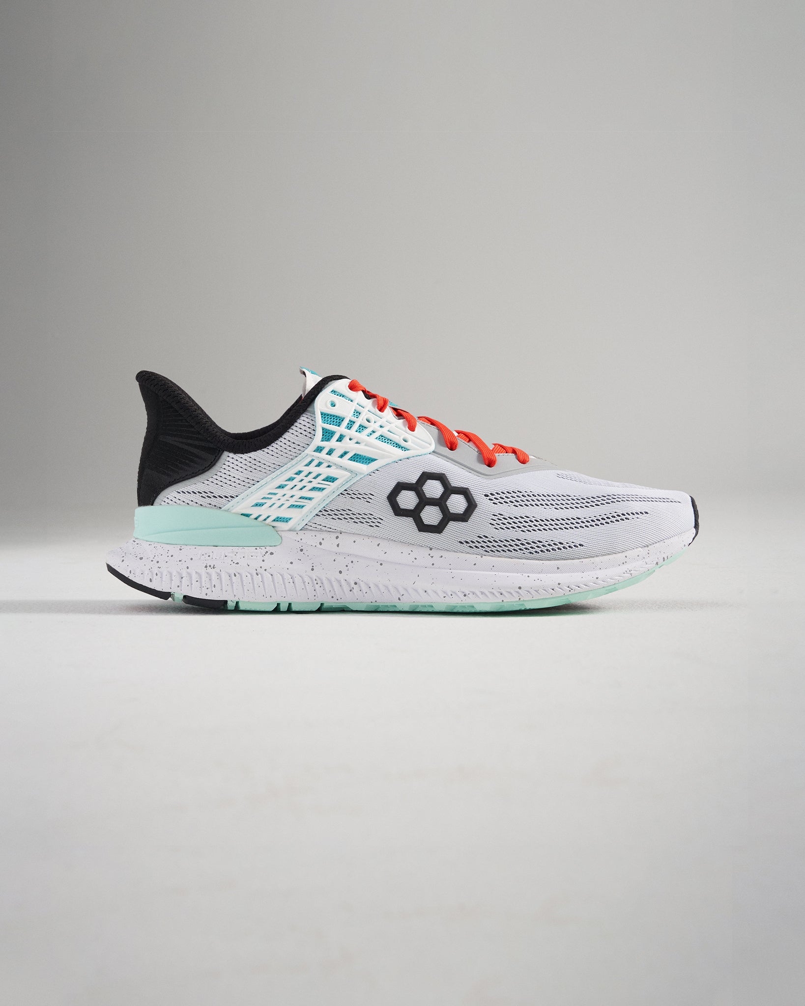 A side view of a modern gray and white athletic running shoe featuring breathable mesh construction vibrant orange laces and a cushioned sole with teal accents for optimal performance