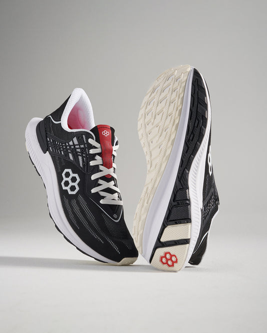 A pair of modern black running shoes with a breathable upper vibrant red accents and a durable sole designed for performance