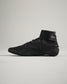 A sleek black athletic shoe featuring a high-top design textured surface and durable sole for performance and stability