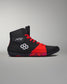 RUDIS black wrestling shoe with red accents, mesh upper, and a segmented outsole for traction.