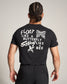 A black t-shirt with a motivational quote featuring a butterfly and a bee illustration on the back