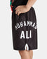 Black sports shorts featuring the name MUHAMMAD ALI in bold white letters on the back designed for childrens active wear