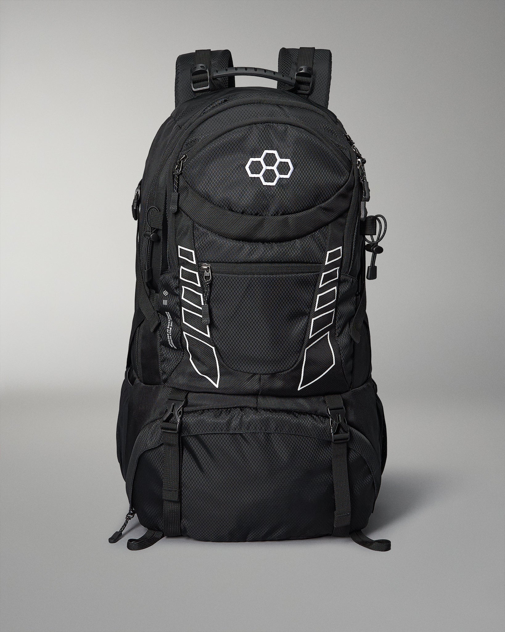 A large black backpack with a textured surface, multiple compartments, and white accents, designed for versatile use, set against a neutral gray background.