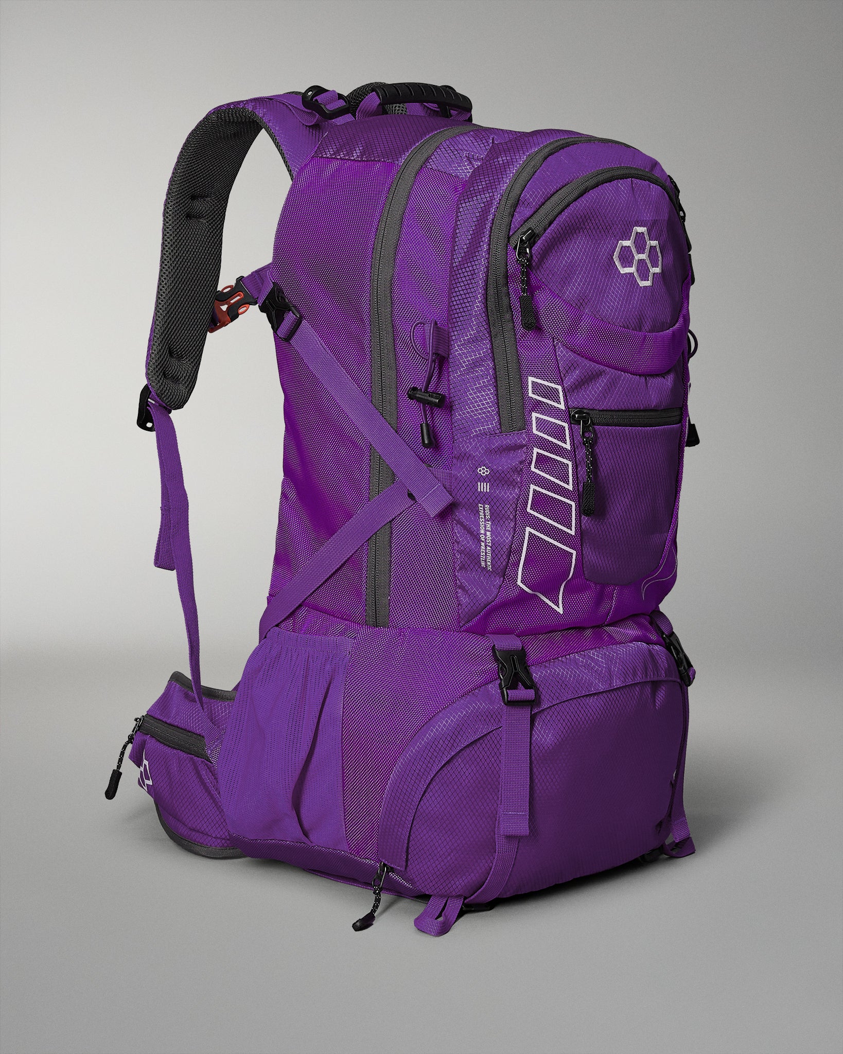 Purple backpack with multiple compartments and padded straps for comfort, featuring reflective details and additional side pockets for practicality.