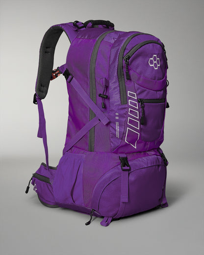 Purple backpack with multiple compartments and padded straps for comfort, featuring reflective details and additional side pockets for practicality.