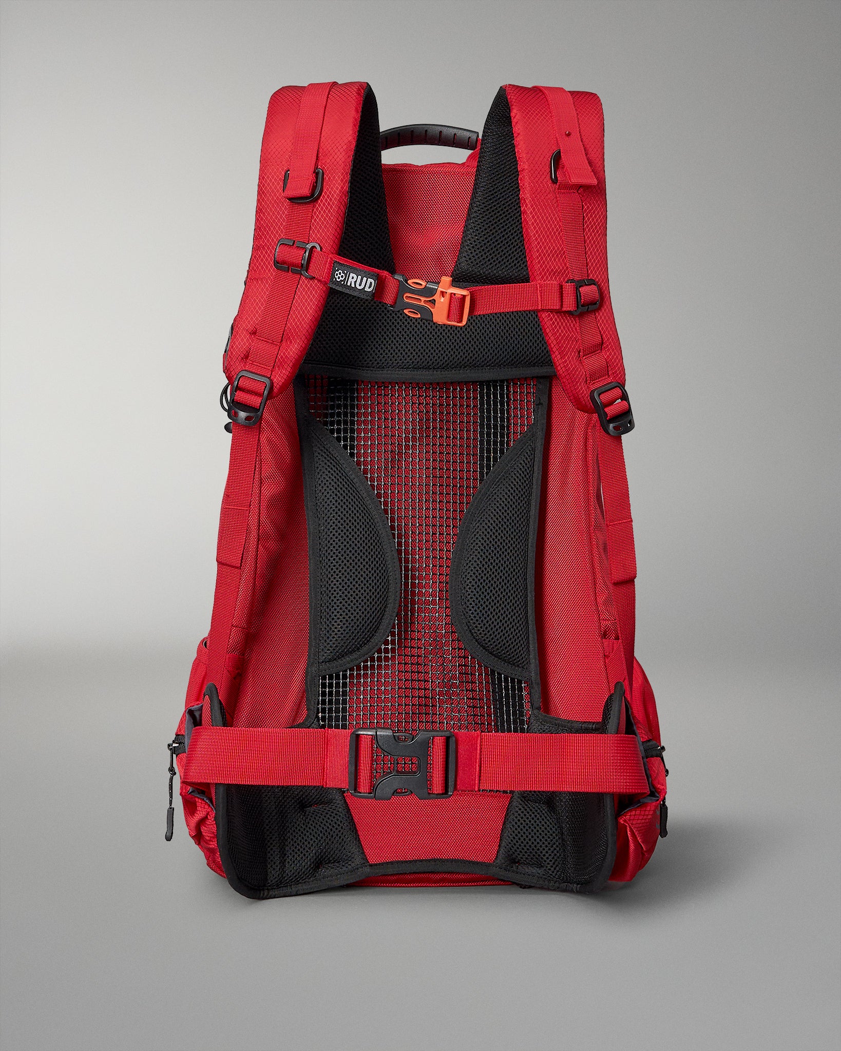 A vibrant red backpack designed for comfort and durability featuring padded shoulder straps mesh detailing and a sturdy buckle for secure fastening