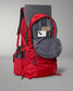 A vibrant red backpack features multiple compartments including space for a laptop a phone and a water bottle highlighting its practicality for students or travelers