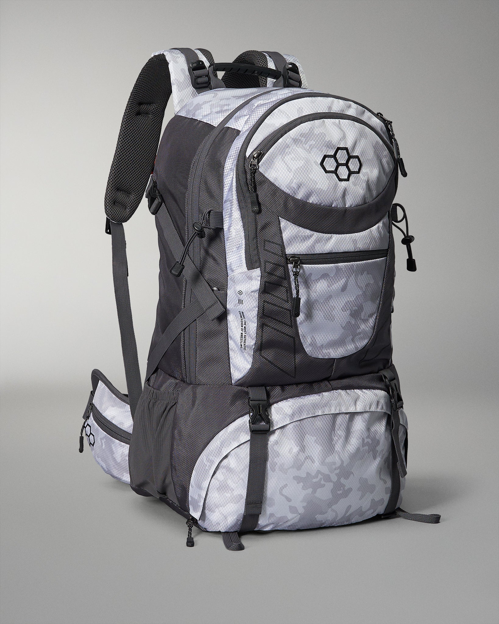 This image displays a sleek gray and white backpack designed for outdoor activities featuring multiple storage compartments and adjustable straps