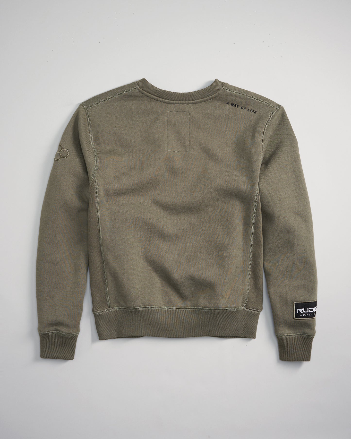 This image portrays a comfortable olive-green sweatshirt featuring a minimalist design with a small logo on the sleeve and subtle text on the shoulder