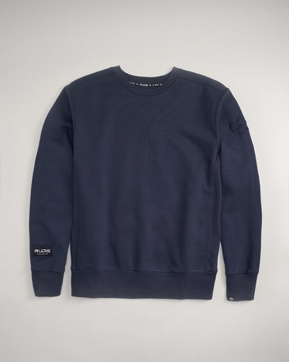 A dark navy sweatshirt featuring a classic crew neck design ribbed cuffs and a logo patch on the sleeve suitable for casual wear