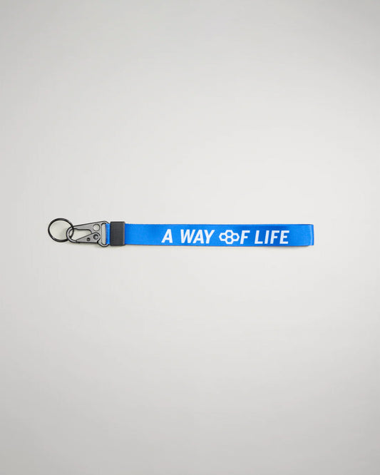 A vibrant blue keychain strap featuring the phrase A WAY OF LIFE in bold white letters designed for both style and utility