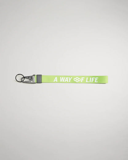 A vibrant green lanyard featuring the phrase A WAY OF LIFE in bold white letters equipped with a metal clip and keyring for secure attachment