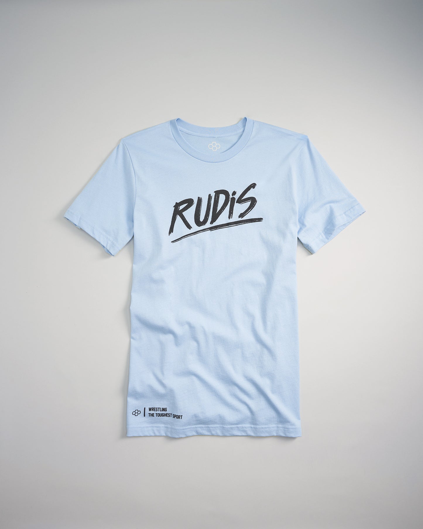 A light blue t-shirt featuring bold black text that reads RUDIS along with the tagline WRESTLING THE TOUGHEST SPORT at the bottom