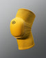 A vibrant yellow knee pad designed for optimal protection and support during physical activities featuring a padded area and breathable material