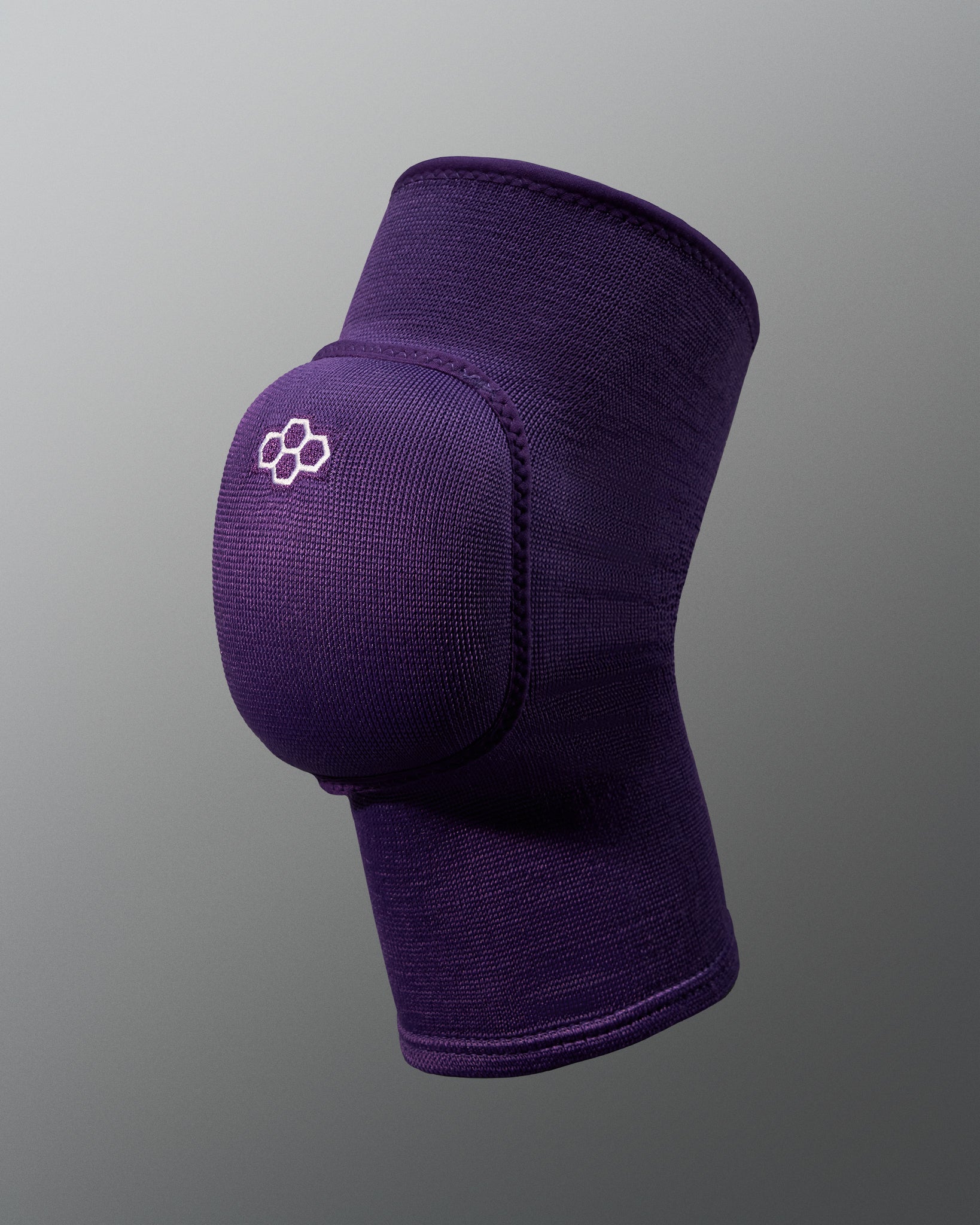 A purple elastic knee support with a contoured design for enhanced stability and comfort during physical activities