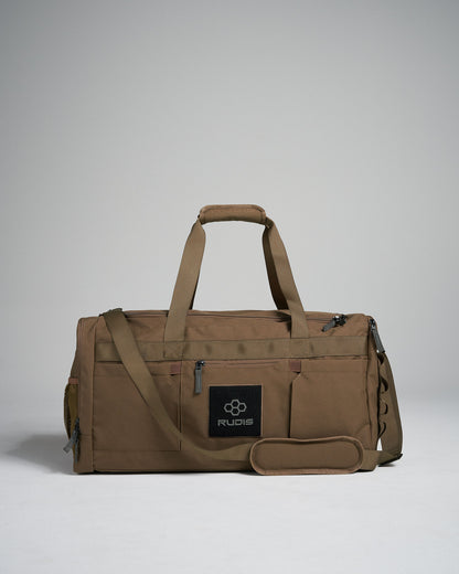 A sturdy tan duffel bag featuring a textured fabric a prominent black logo and multiple pockets for organization