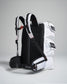 This image features a modern backpack with a unique design combining a black and white color scheme alongside adjustable straps and multiple compartments for enhanced functionality