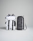 A stylish white backpack alongside a compact black mesh bag showcasing modern design features and functional elements